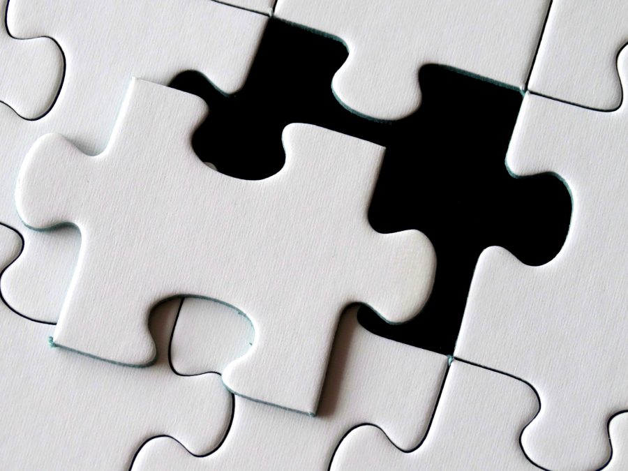 A photo of a puzzle piece fitting into its place