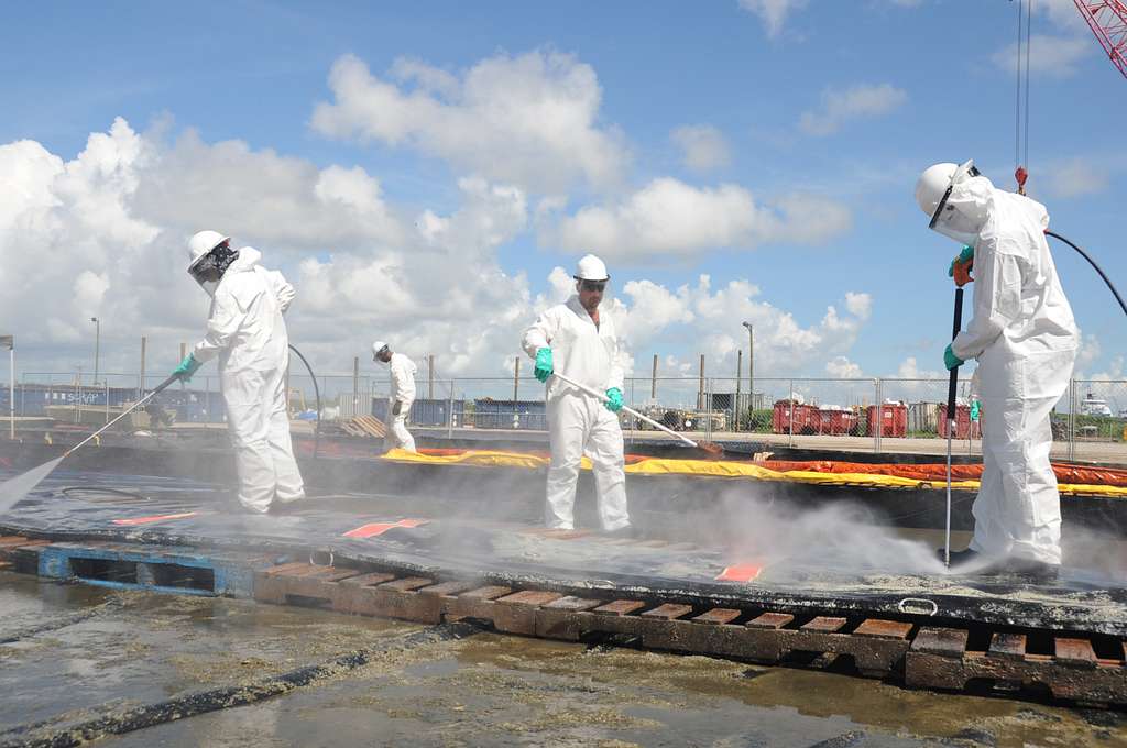 Workers clean up LLM slop. Source: US Coast Guard
